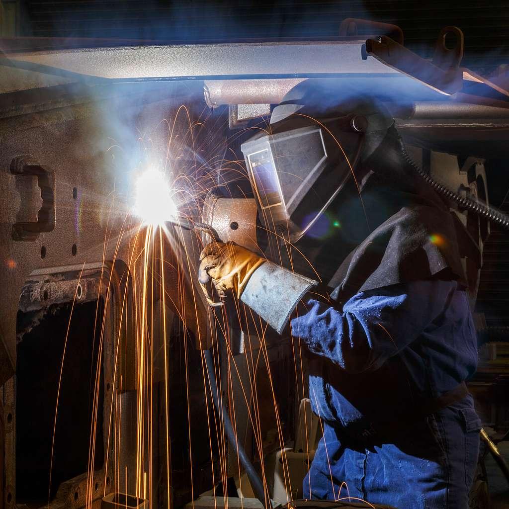 A welder performing flux cored arc welding