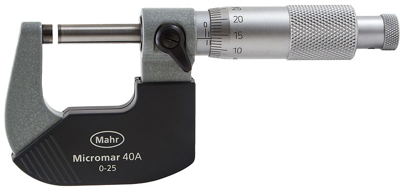 A micrometer, a measurement tool that looks like a small c-clamp with a rotating dial where the screw handle is. The micrometer is slightly open, leaving a space between the moving bar and the small cylinder (anvil) at the end of the tool. The dial shows a metric scale and the label on the side of the tool indicates that it will measure objects from 0 to 25 millimeters.