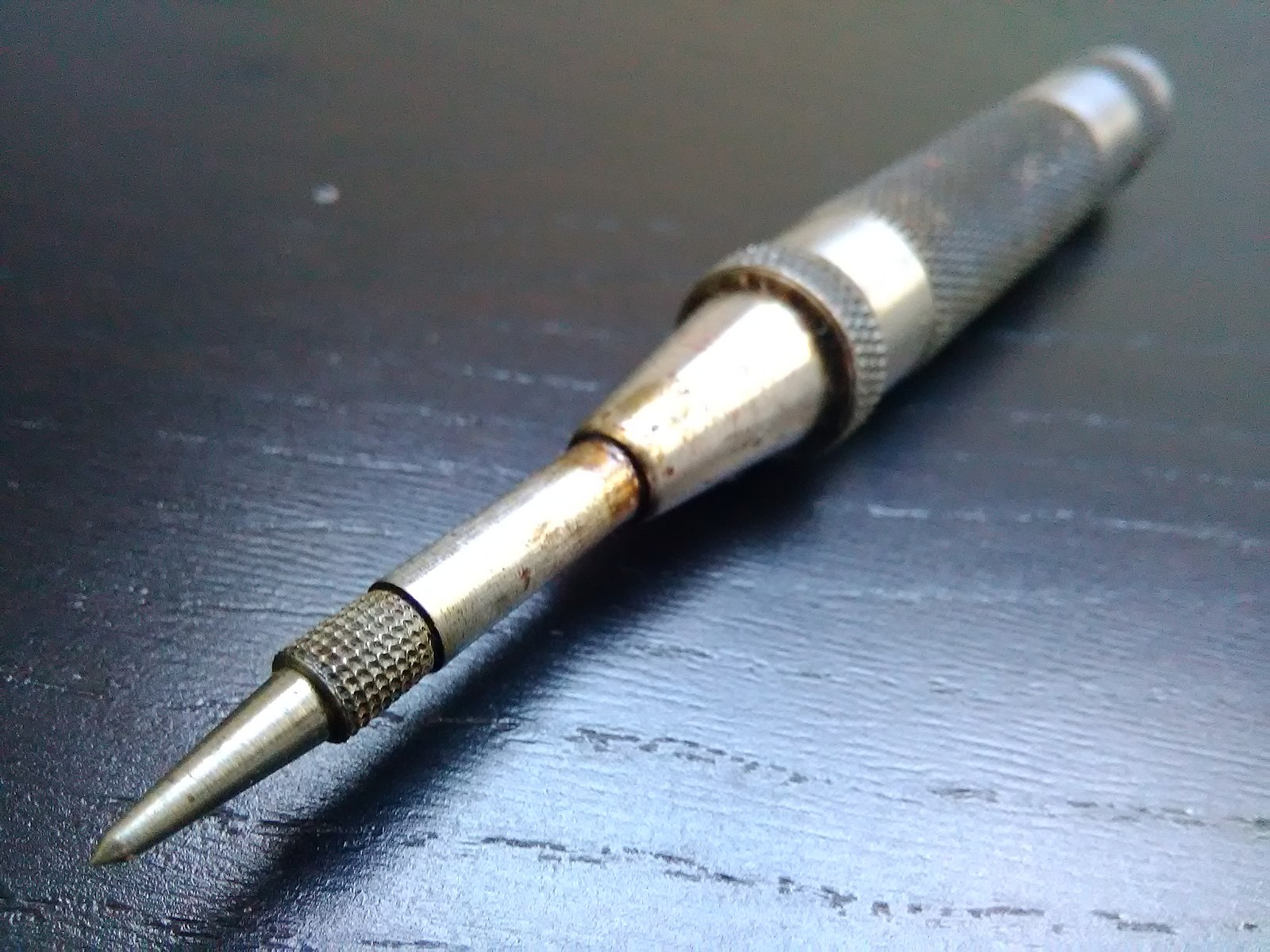 A spring-loaded center punch.