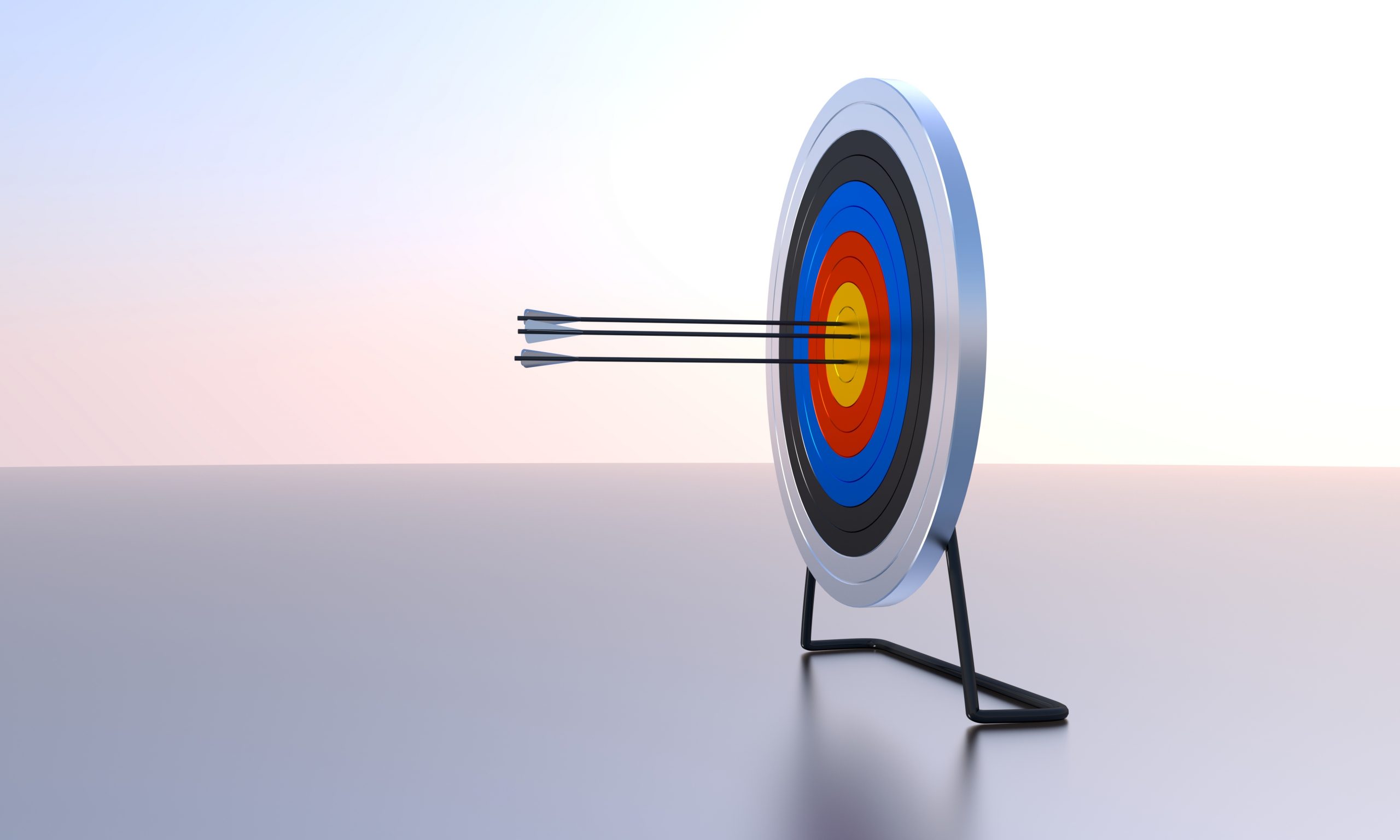 Target with three arrows in the bull's eye.