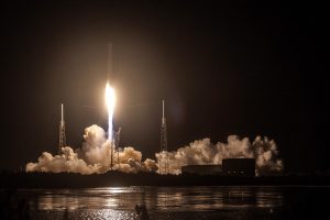 The image captures the launch of a SpaceX Falcon 9 rocket carrying the CRS-9 (Commercial Resupply Service 9) mission to the International Space Station (ISS). The CRS-9 mission, part of NASA's partnership with SpaceX, involved delivering supplies, equipment, and scientific experiments to the ISS. The photograph showcases the rocket ascending into the sky, leaving a trail of exhaust plumes, as it embarks on its journey to the orbiting laboratory.