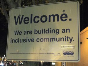 Sign reading &quot;Welcome, We are building an inclusive community.&quot;