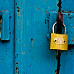 gold lock against blue door