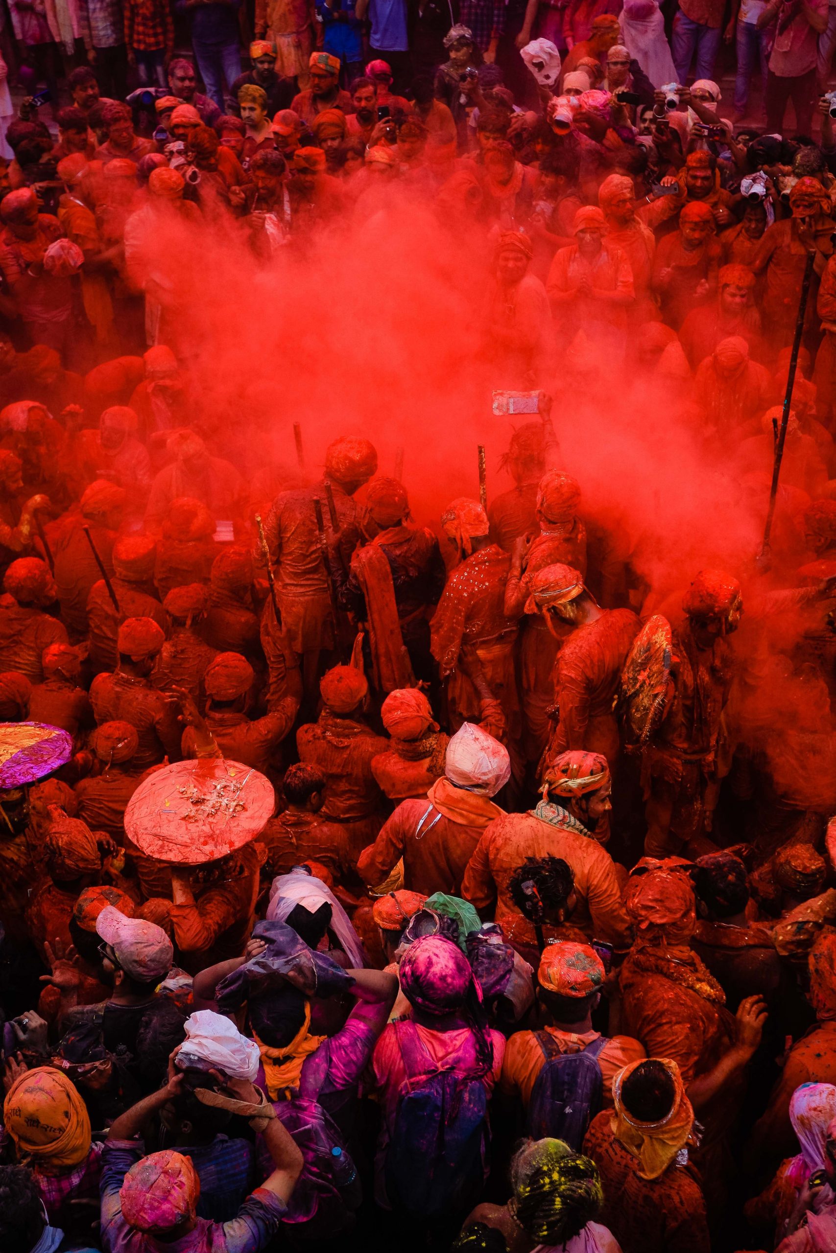 people celebrating Holi festival with colored powder