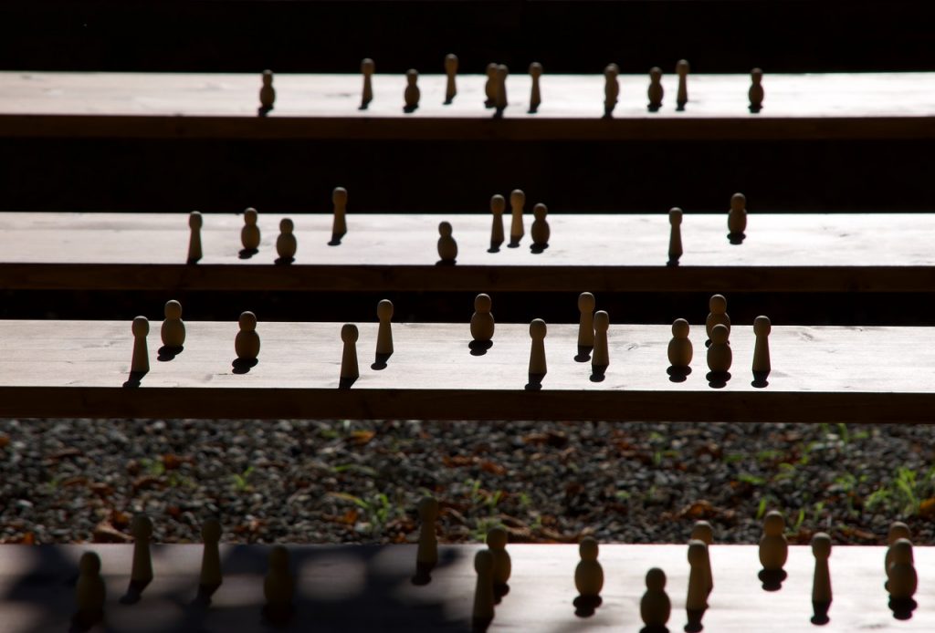 Randomly placed wooden figurines on steps