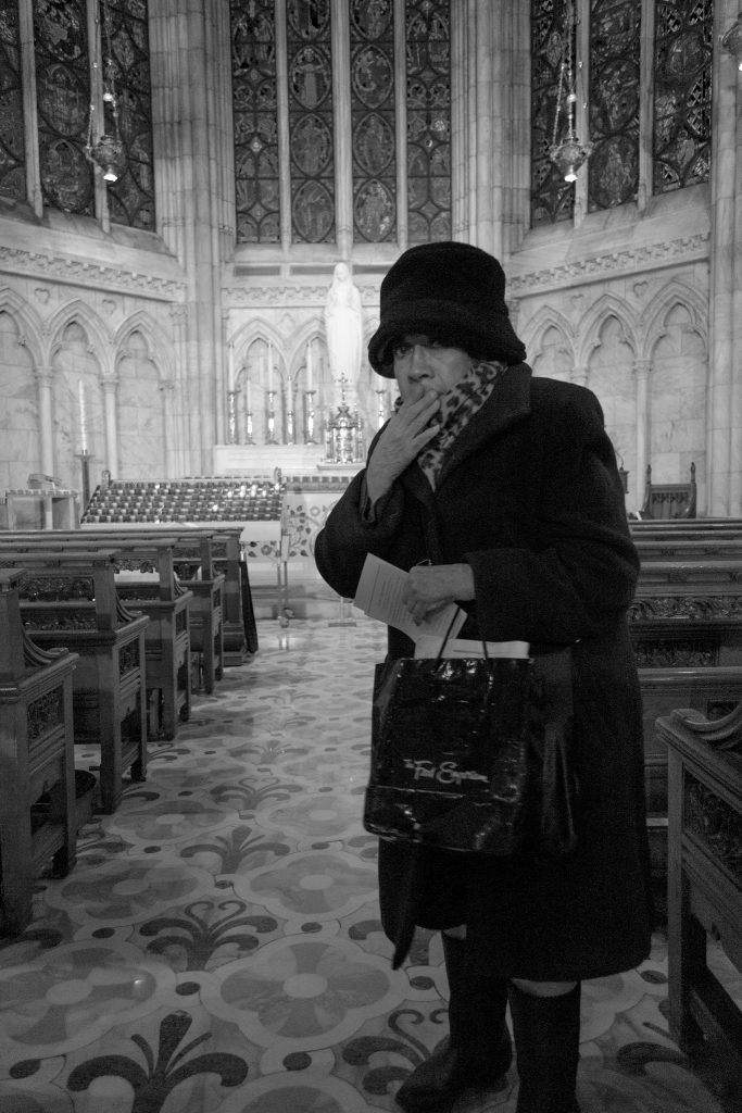 Woman in church looking worried